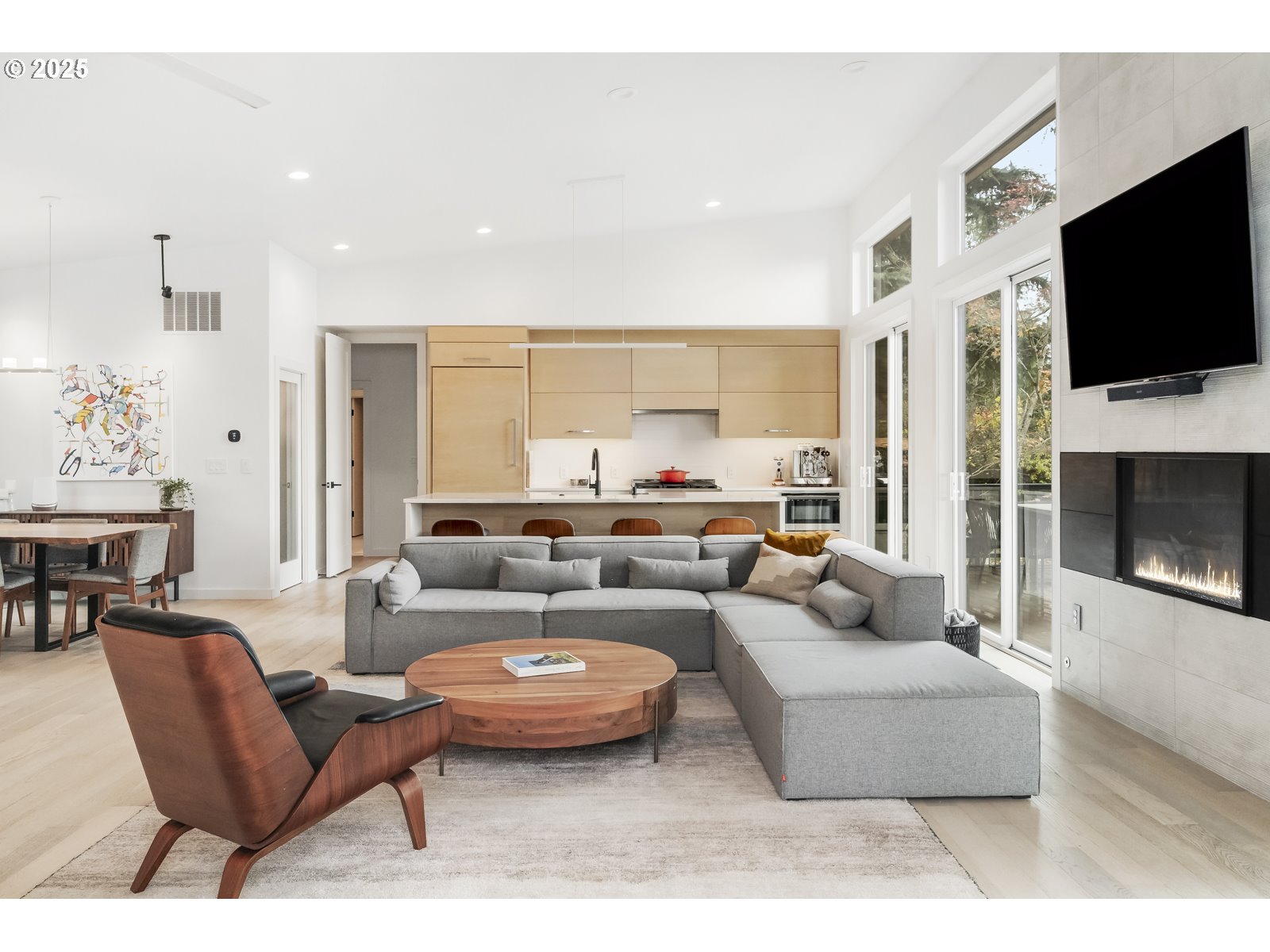 11504 Northwest Damascus Street Portland, OR 97229 - Photo 7 of 48 a living room with fireplace furniture and a flat screen tv