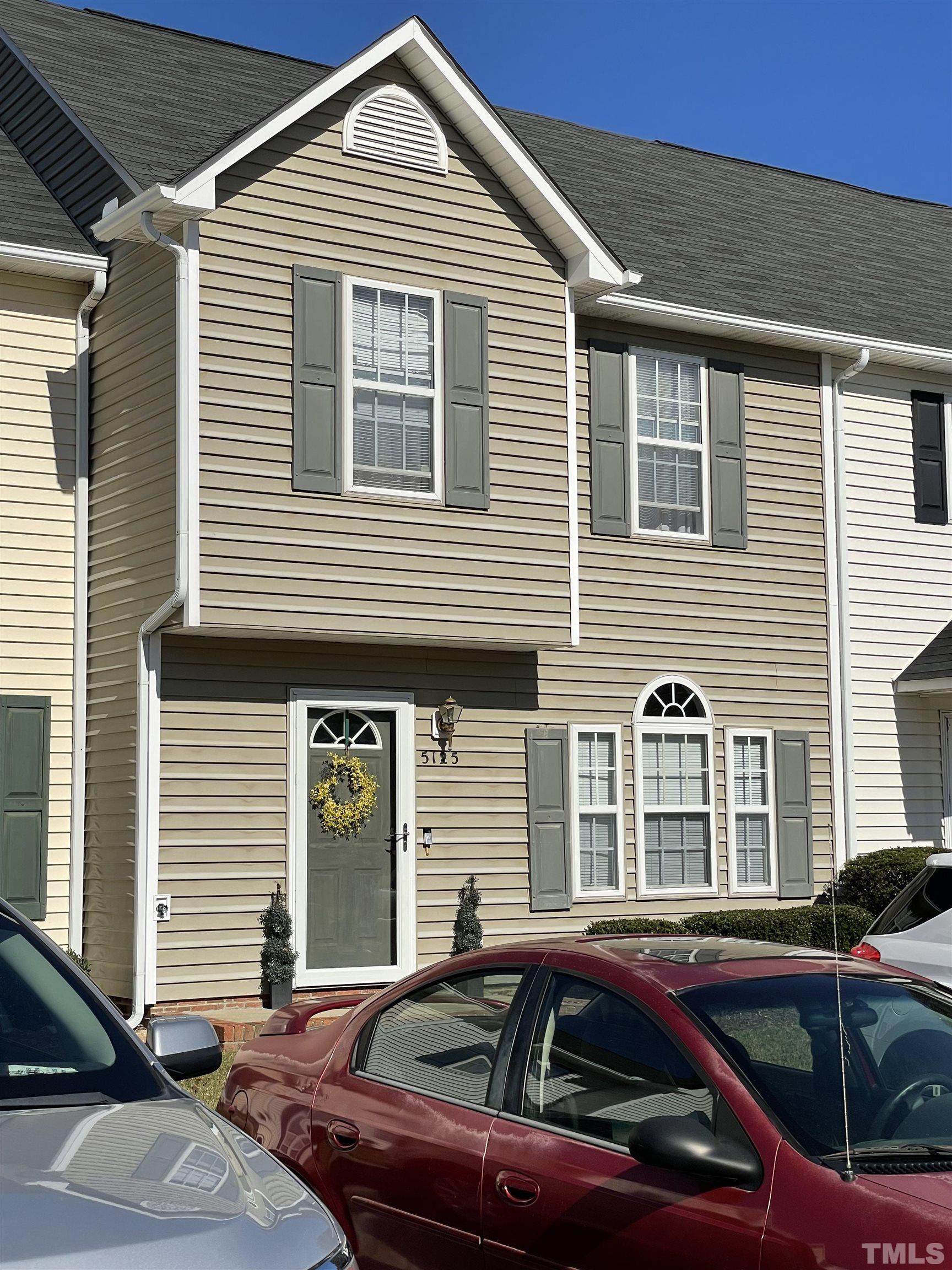 5125 Mass Rock Drive Raleigh, NC 27610 - Photo 1 of 3 a front view of a house with cars parked