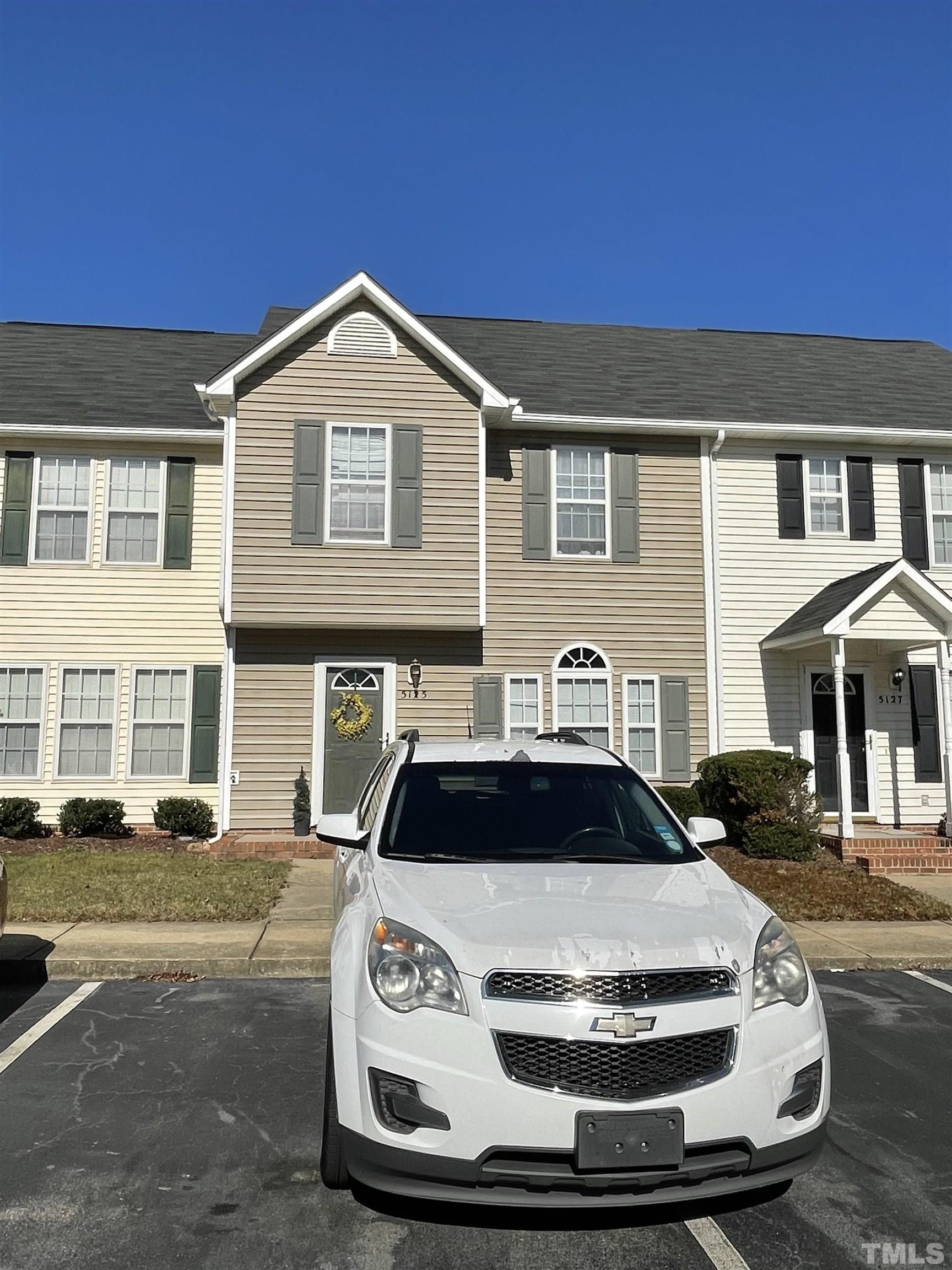 5125 Mass Rock Drive Raleigh, NC 27610 - Photo 2 of 3 a front view of a house with a yard