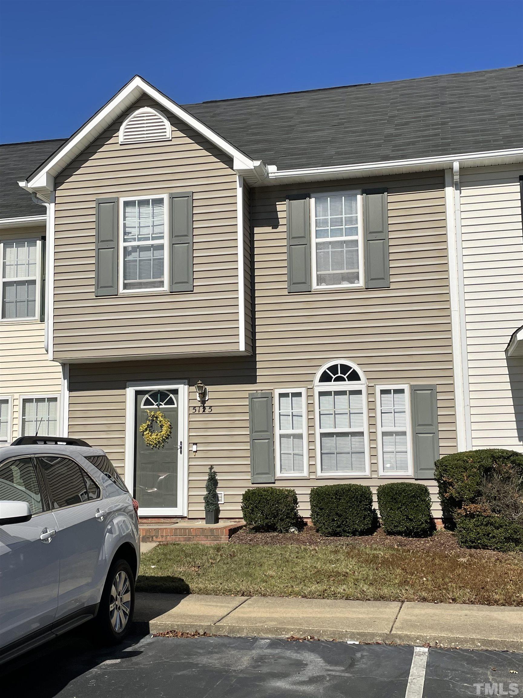 5125 Mass Rock Drive Raleigh, NC 27610 - Photo 3 of 3 a front view of a house with a parking space