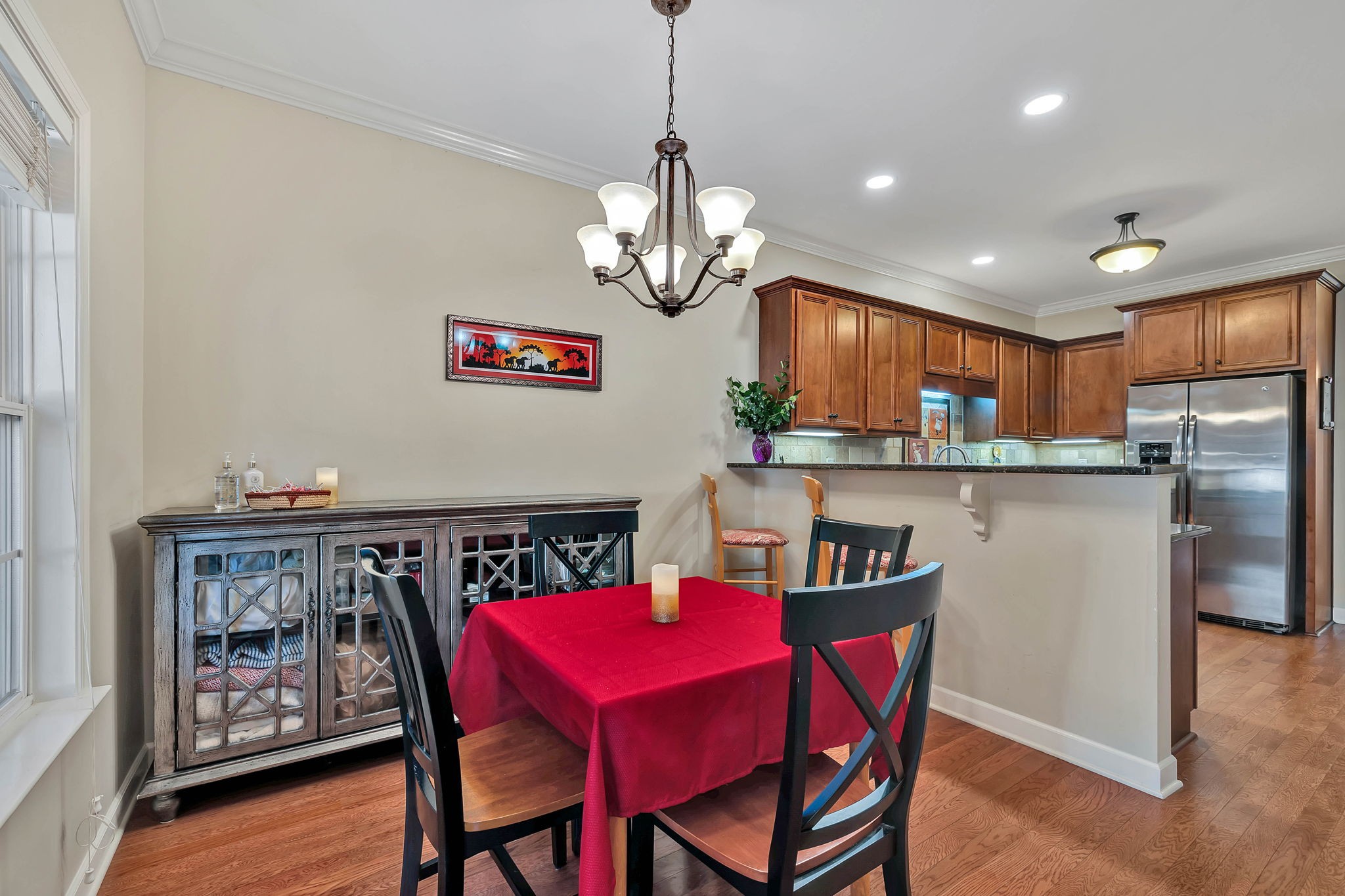2138 Cason Lane Murfreesboro, TN 37128 - Photo 11 of 55 a view of a dining room with furniture a chandelier and wooden floor