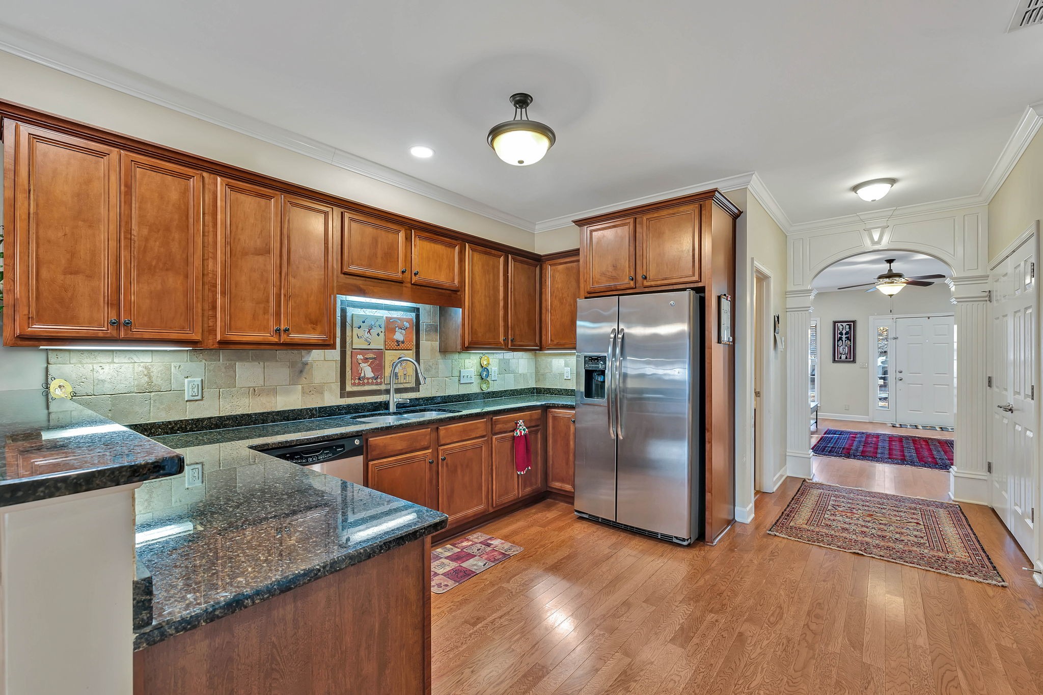 2138 Cason Lane Murfreesboro, TN 37128 - Photo 12 of 55 a kitchen with stainless steel appliances granite countertop a refrigerator a sink dishwasher a stove with wooden cabinets and floor