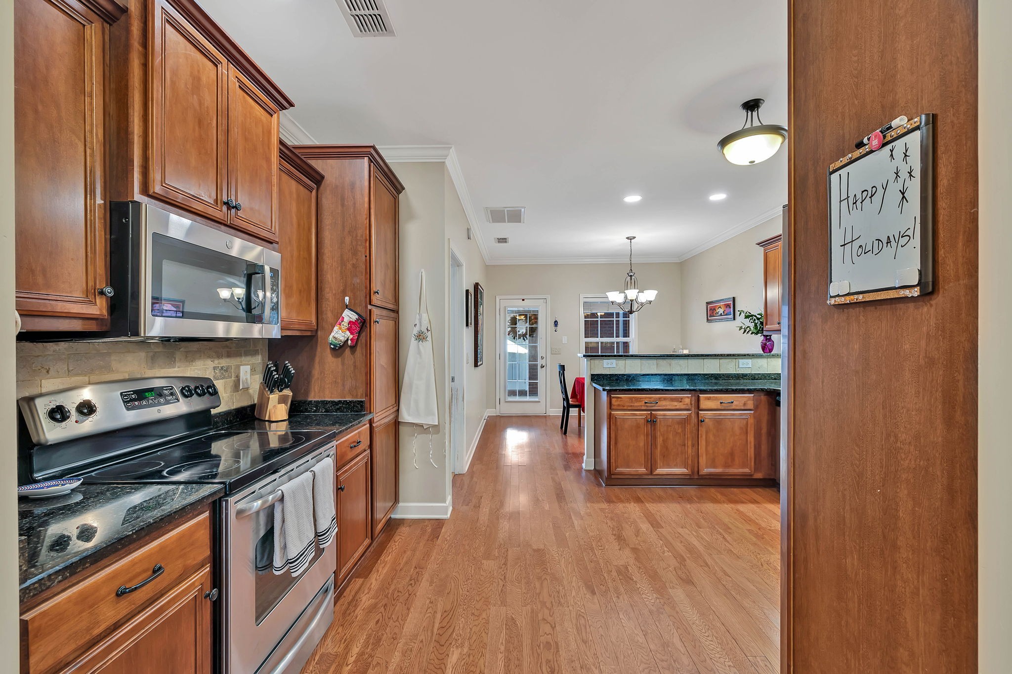 2138 Cason Lane Murfreesboro, TN 37128 - Photo 23 of 55 a kitchen with stainless steel appliances granite countertop a refrigerator a stove top oven and a sink with granite countertops