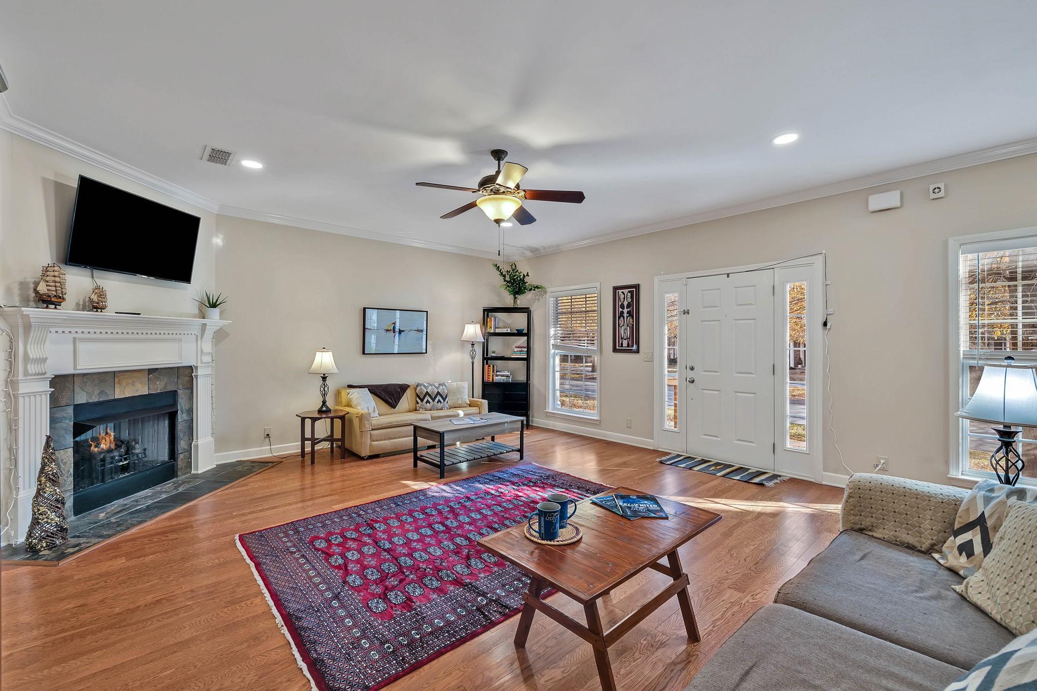 2138 Cason Lane Murfreesboro, TN 37128 - Photo 8 of 55 a living room with furniture a flat screen tv and a fireplace