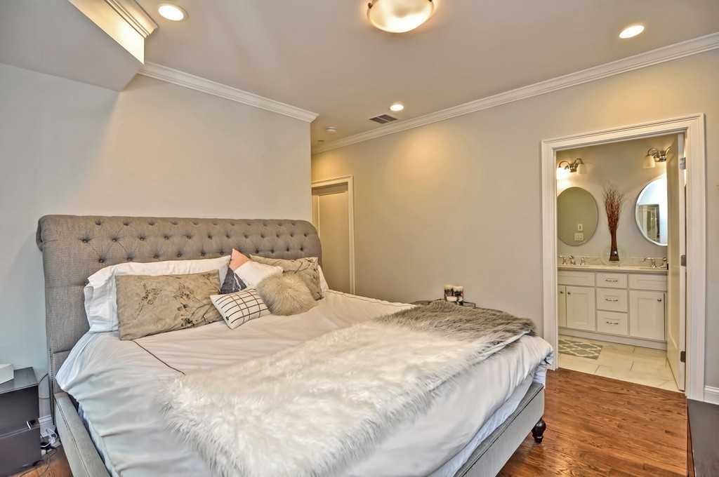 28 Iffley Road, Unit 2 Boston, MA 02130 - Photo 8 of 18 a bedroom with a large bed and dresser