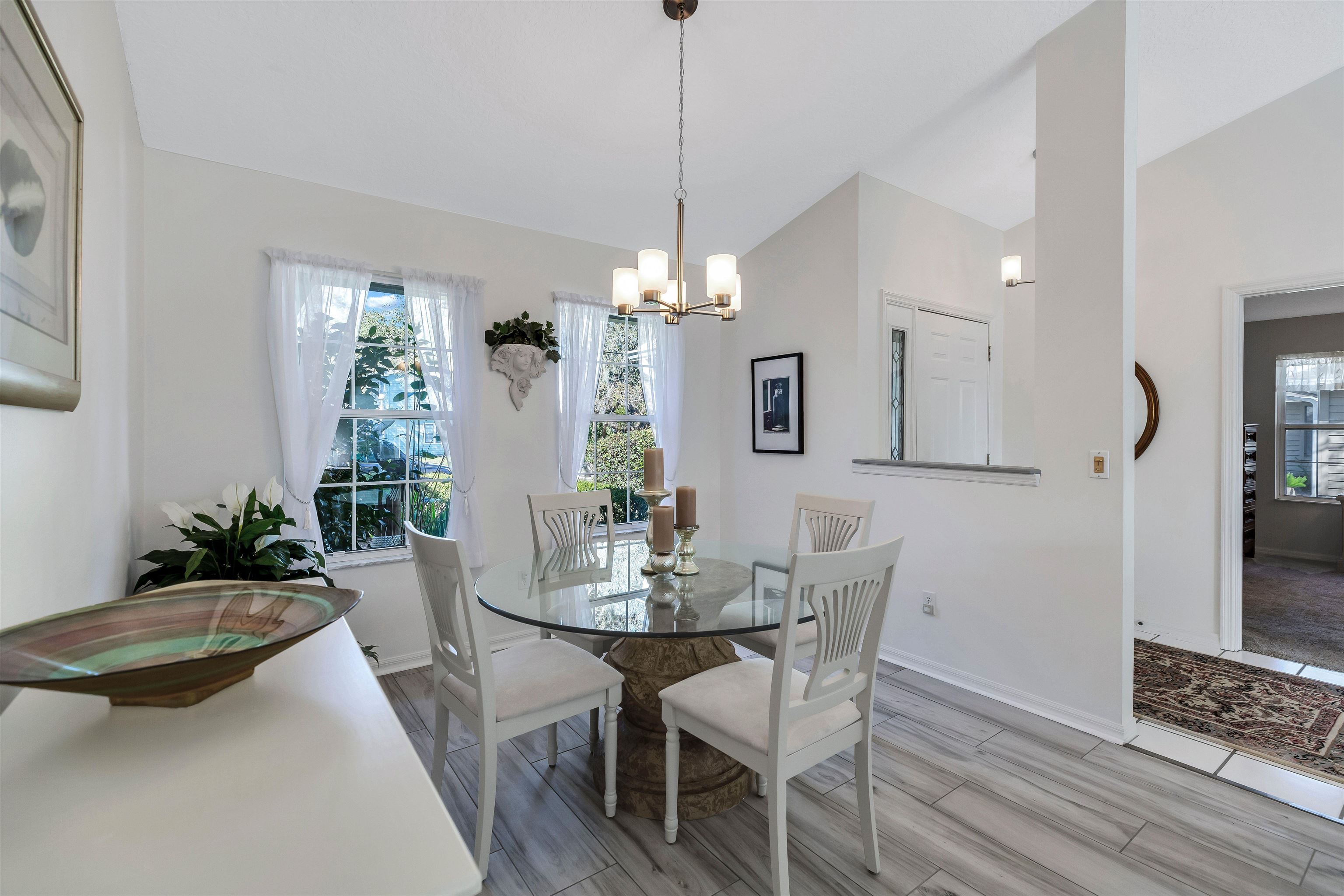 134 Pelican Road St. Augustine, FL 32086 - Photo 13 of 43 a view of a dining room with furniture and wooden floor