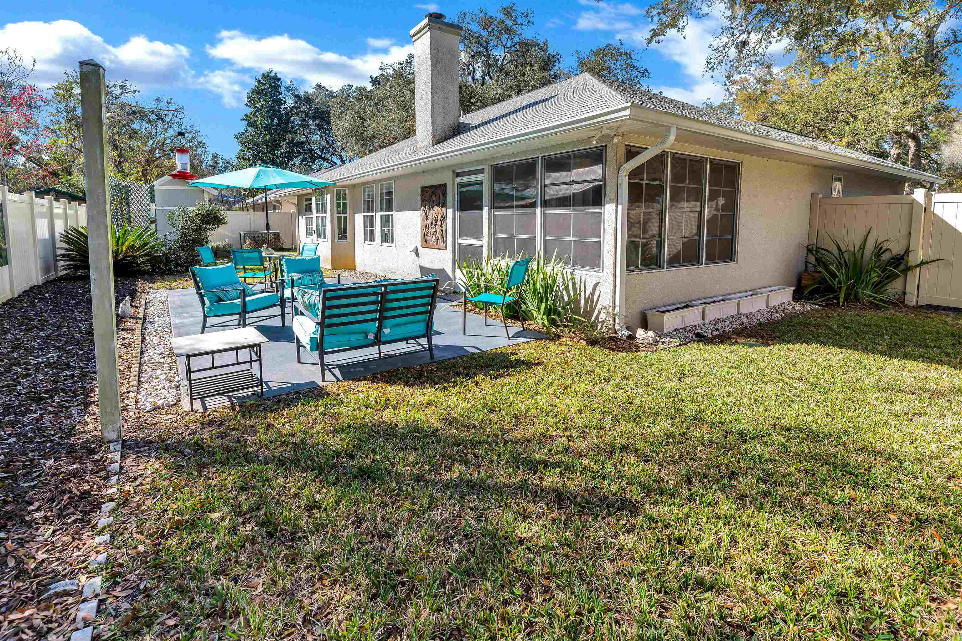 134 Pelican Road St. Augustine, FL 32086 - Photo 32 of 43 a view of a house with backyard and sitting area