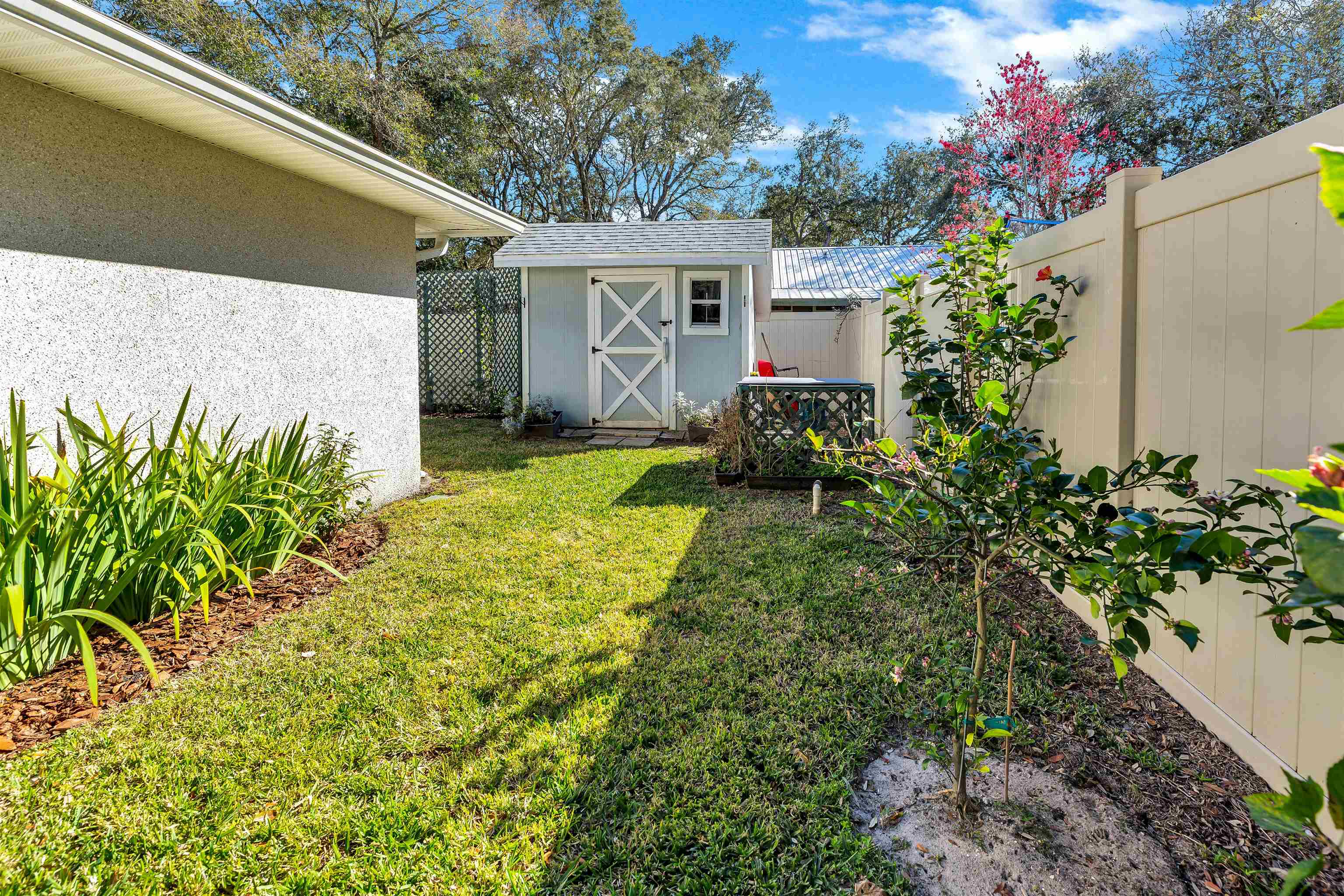 134 Pelican Road St. Augustine, FL 32086 - Photo 34 of 43 a view of a house with a backyard