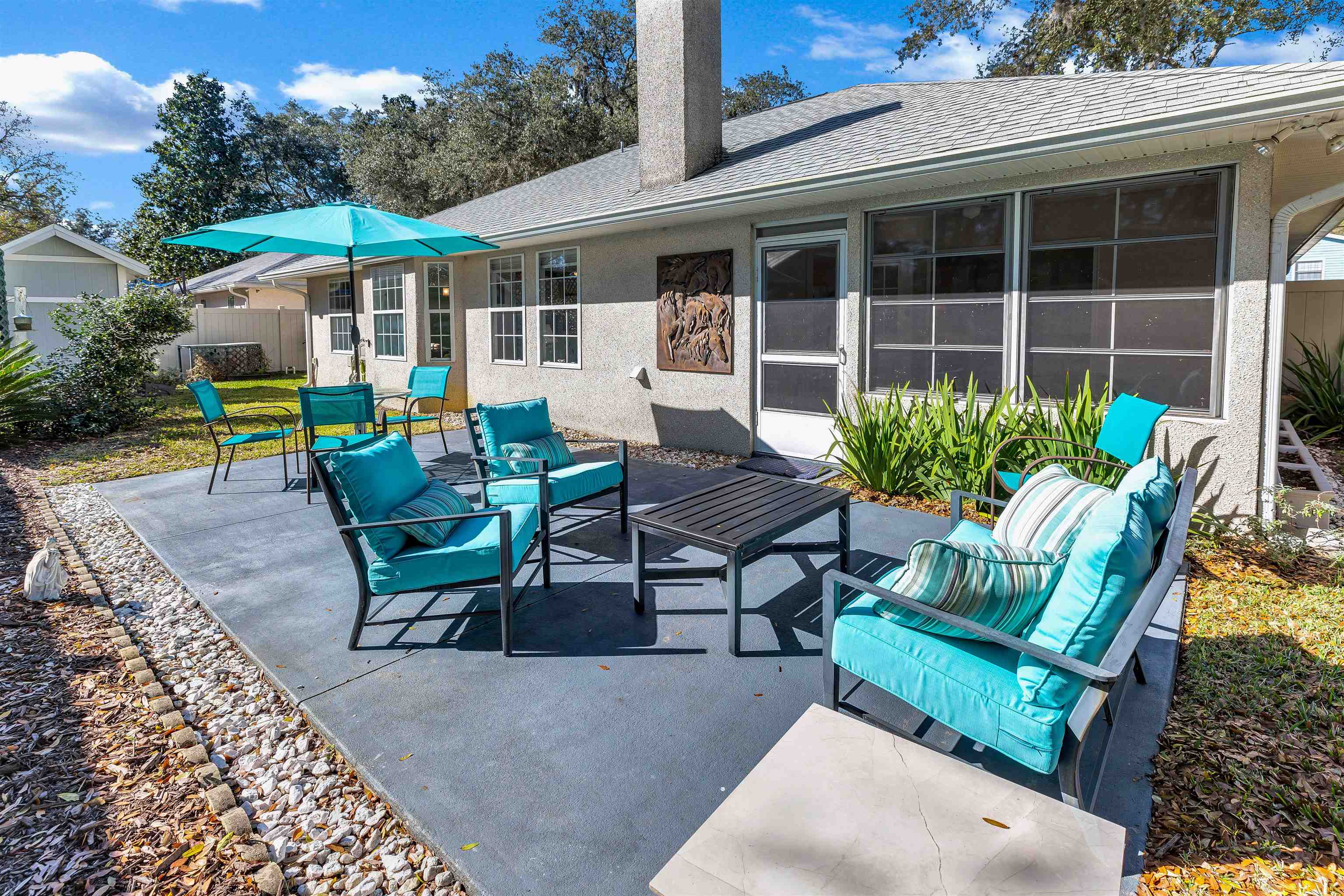134 Pelican Road St. Augustine, FL 32086 - Photo 36 of 43 a view of a house with a deck and a patio