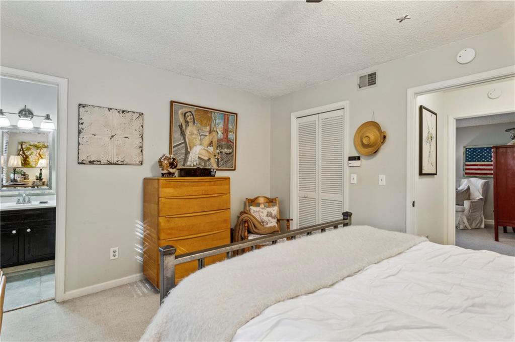 162 Lablanc Way Northwest Atlanta, GA 30327 - Photo 14 of 22 a bedroom with a bed and a window