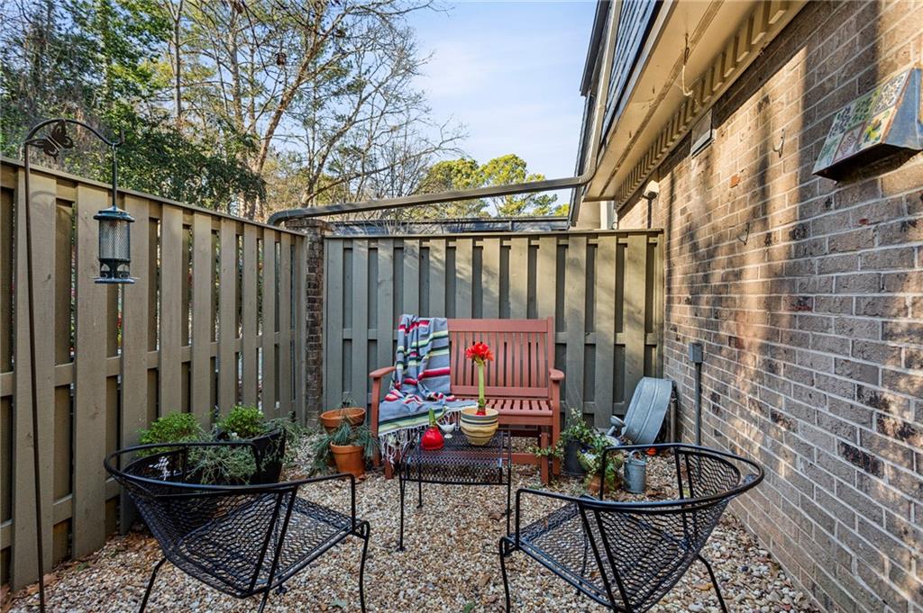 162 Lablanc Way Northwest Atlanta, GA 30327 - Photo 21 of 22 a backyard of a house with barbeque oven table and chairs