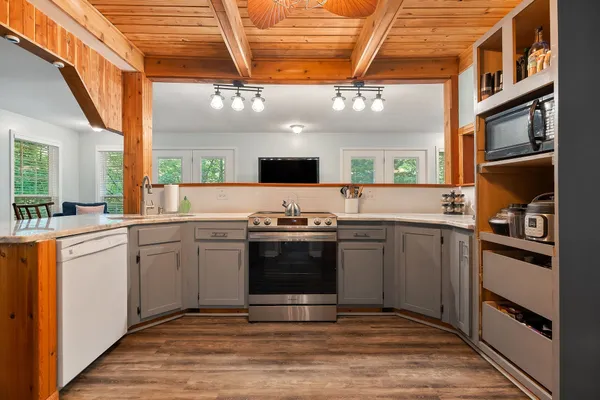 a kitchen with a sink cabinets and stainless steel appliances