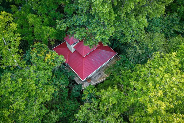 an aerial view of a house with a yard