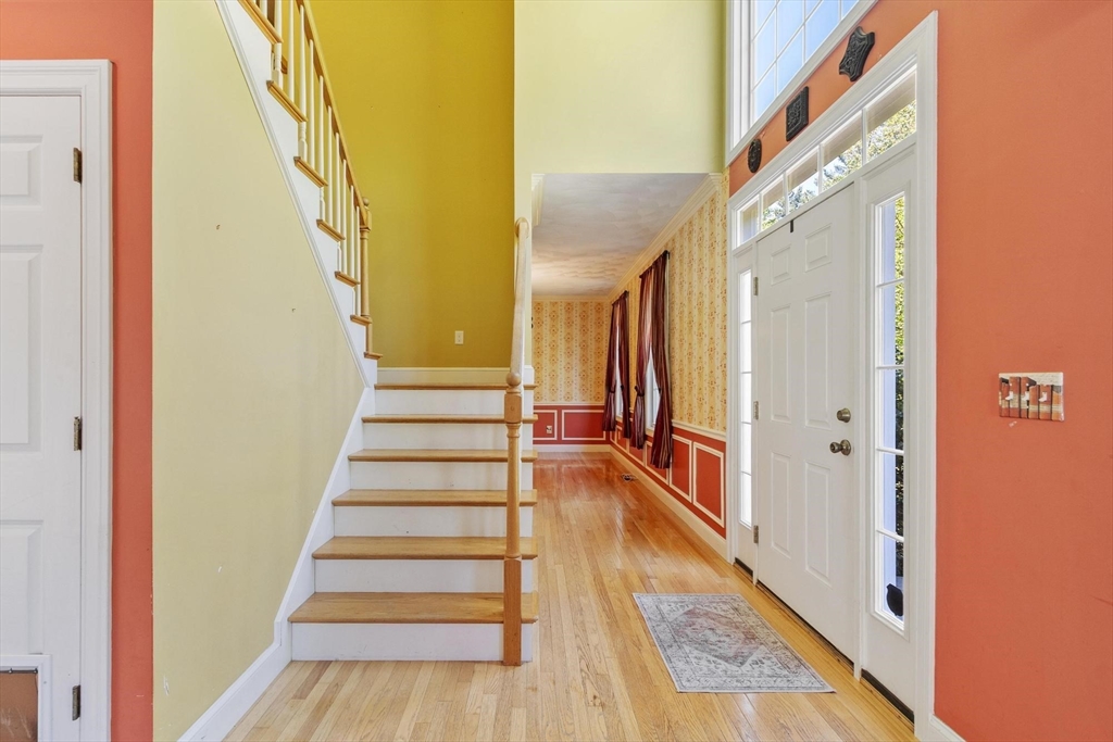 4 Forest Street Georgetown, MA 01833 - Photo 17 of 37 a view of a hallway with wooden floor and staircase