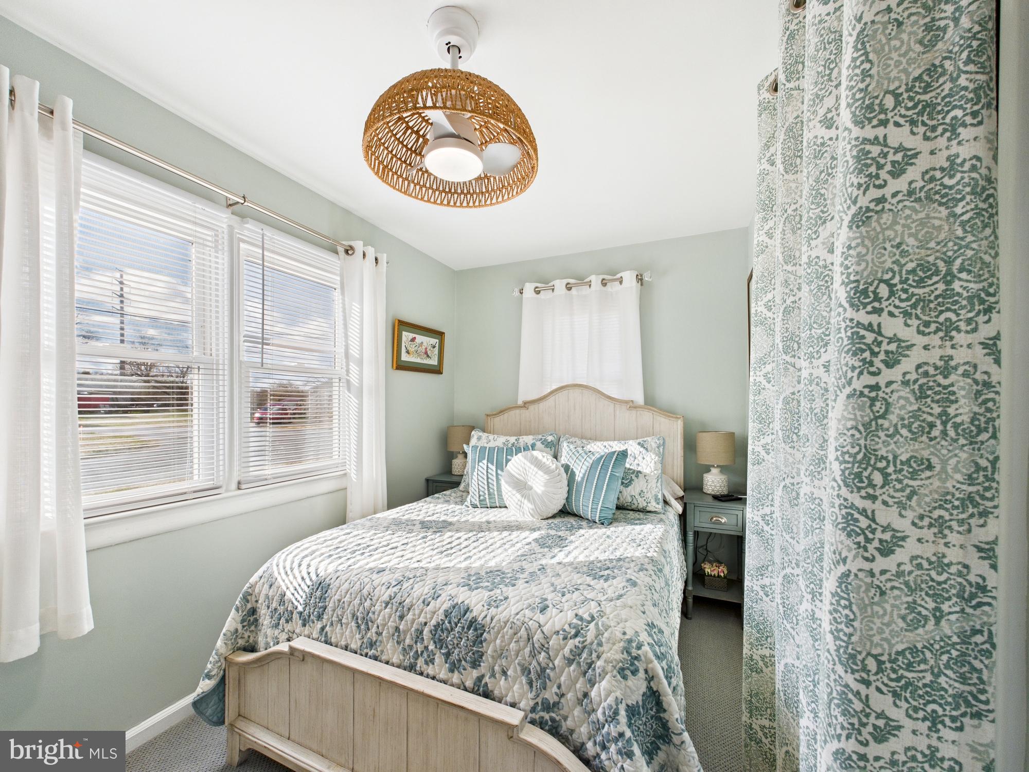301 2nd Street Bridgeville, DE 19933 - Photo 7 of 14 Serene bedroom with natural light and charm.