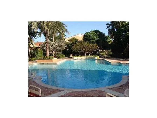 a view of swimming pool with a yard