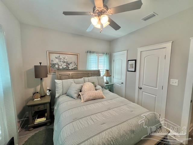 9352 Hall Road Grand Bay, AL 36541 - Photo 12 of 39 a bedroom with a bed and a chandelier