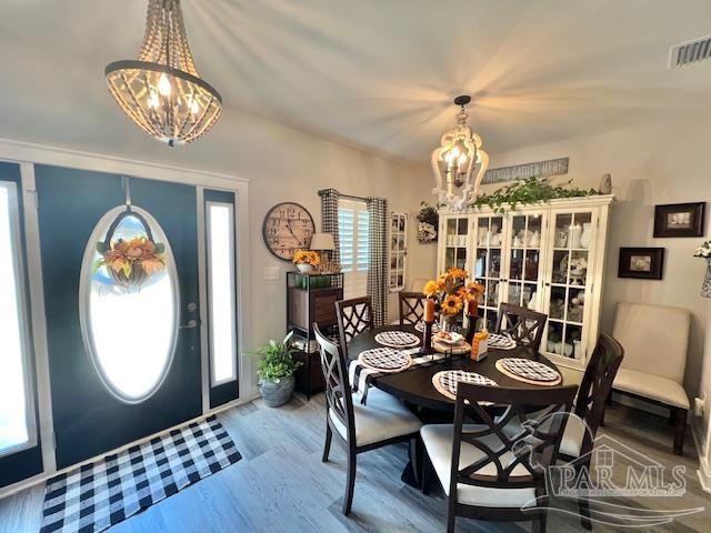 9352 Hall Road Grand Bay, AL 36541 - Photo 2 of 39 a view of a dining room with furniture window and wooden floor