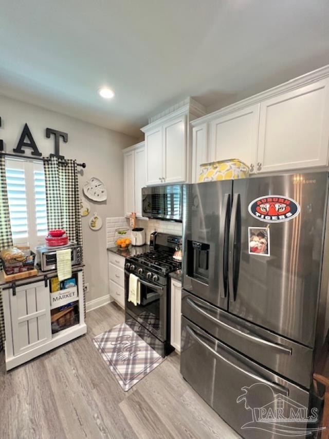 9352 Hall Road Grand Bay, AL 36541 - Photo 8 of 39 a kitchen with stainless steel appliances a refrigerator sink and microwave