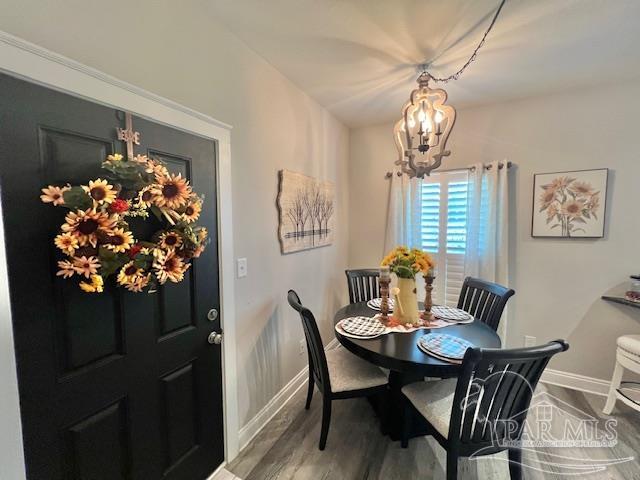 9352 Hall Road Grand Bay, AL 36541 - Photo 10 of 39 a view of a dining room with furniture and chandelier