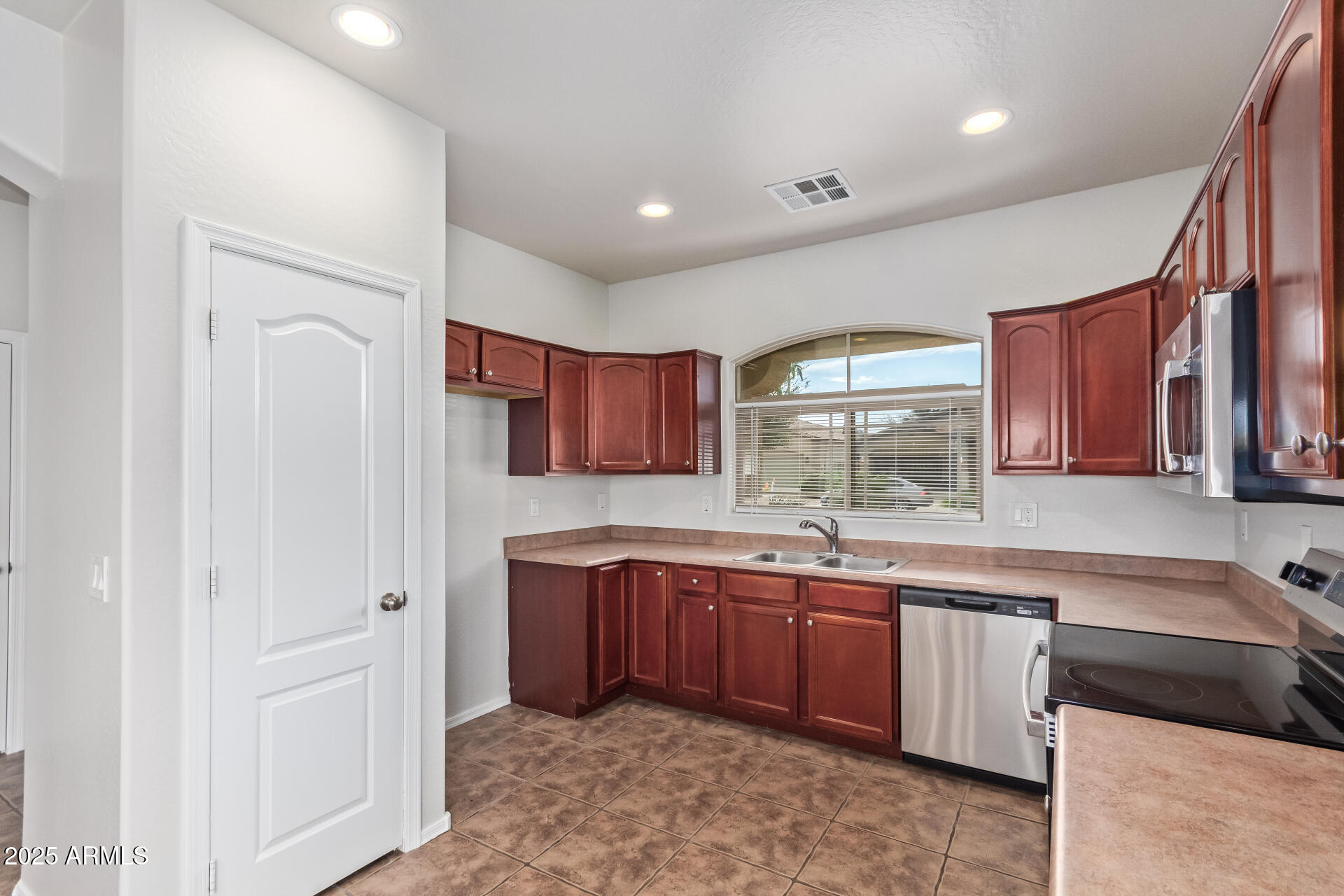 21382 East Via Del Rancho Queen Creek, AZ 85142 - Photo 11 of 29 a kitchen with a sink cabinets and window