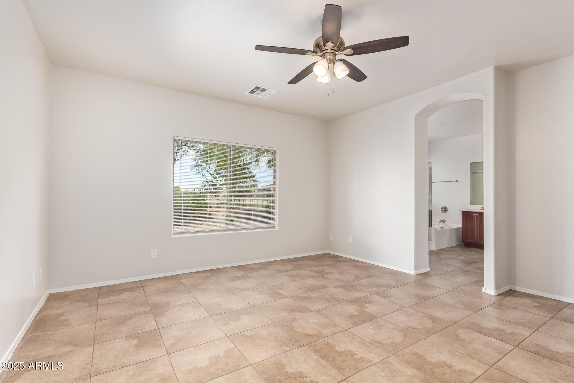 21382 East Via Del Rancho Queen Creek, AZ 85142 - Photo 12 of 29 an empty room with fan and windows