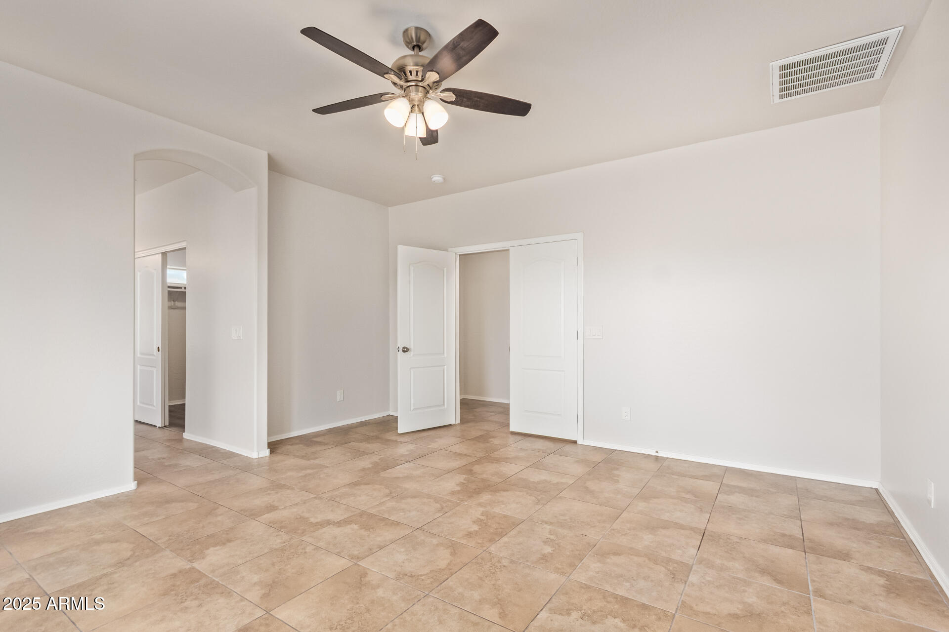 21382 East Via Del Rancho Queen Creek, AZ 85142 - Photo 13 of 29 an empty room with a ceiling fan