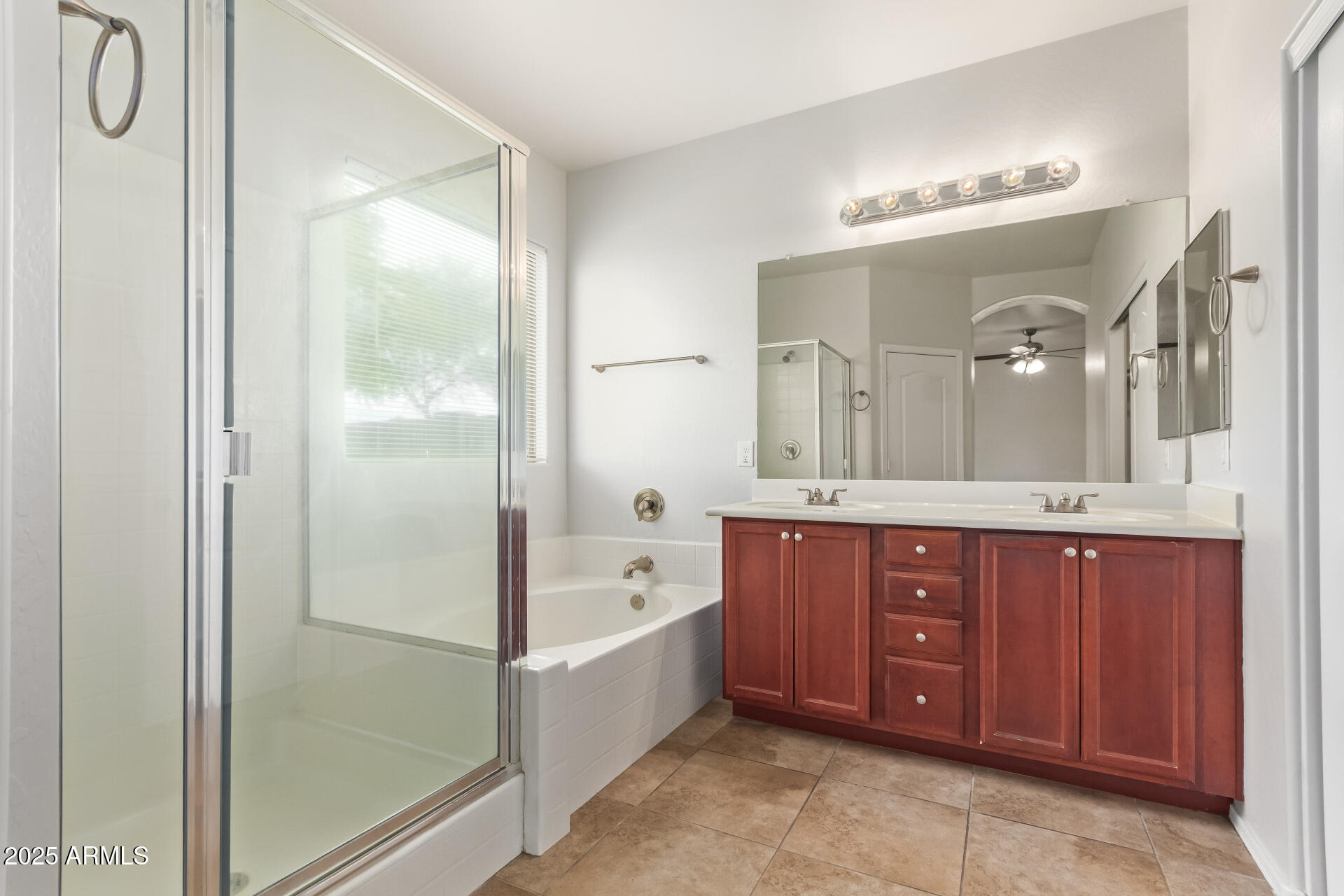 21382 East Via Del Rancho Queen Creek, AZ 85142 - Photo 15 of 29 a spacious bathroom with a tub sink shower and mirror