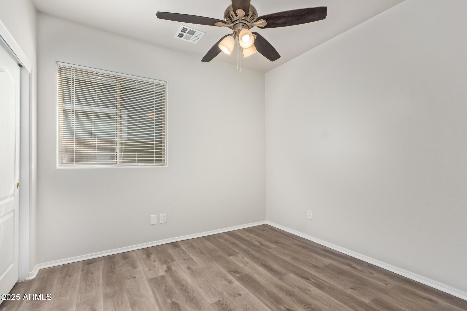 21382 East Via Del Rancho Queen Creek, AZ 85142 - Photo 20 of 29 an empty room with a window and a fan