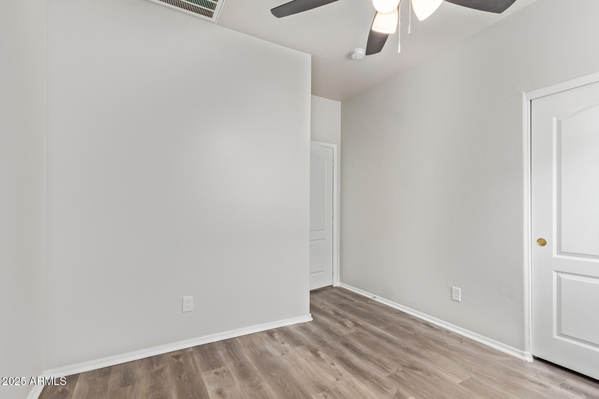 21382 East Via Del Rancho Queen Creek, AZ 85142 - Photo 21 of 29 a view of room with wooden floor