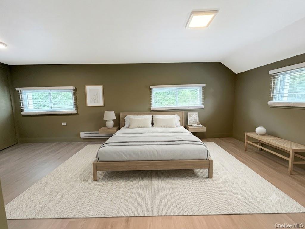 4 Lower Trinity Pass Road Pound Ridge, NY 10576 - Photo 24 of 29 a spacious bedroom with a bed and window