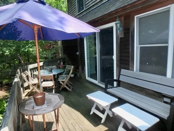 a patio with tables and chairs