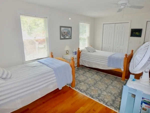 a bedroom with bed and a window