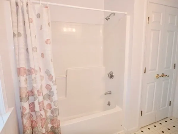 a bathroom with a shower curtain