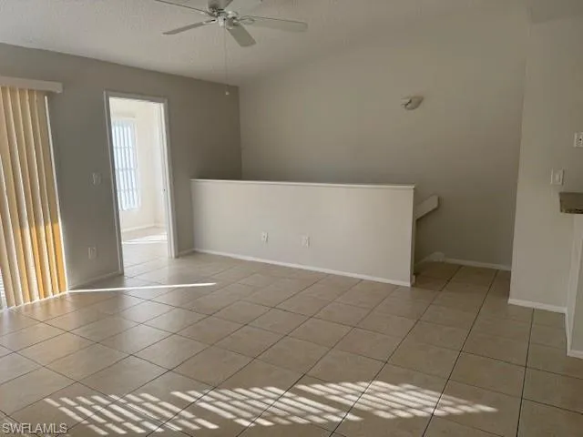 an empty room with a bench