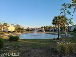 a view of house with swimming pool yard and outdoor seating