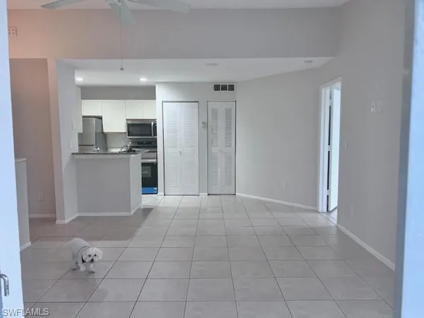 a view of a kitchen with a sink and dishwasher cabinets