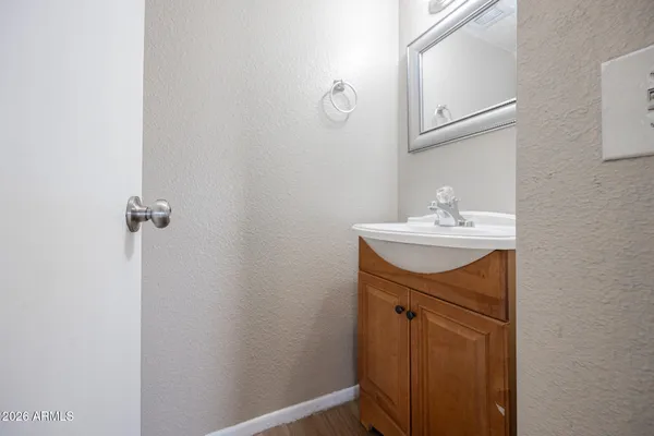 a bathroom with a sink vanity and a mirror