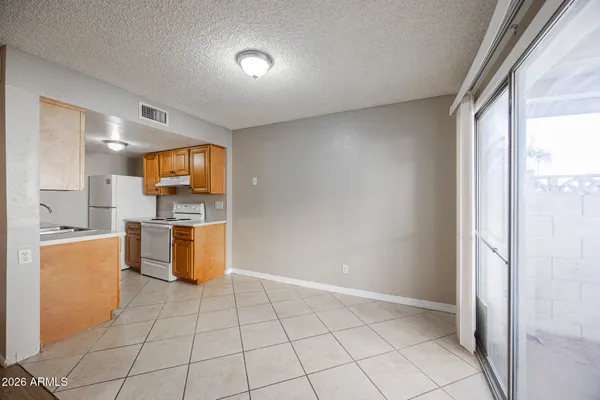 a view of kitchen with a sink stove and cabinets