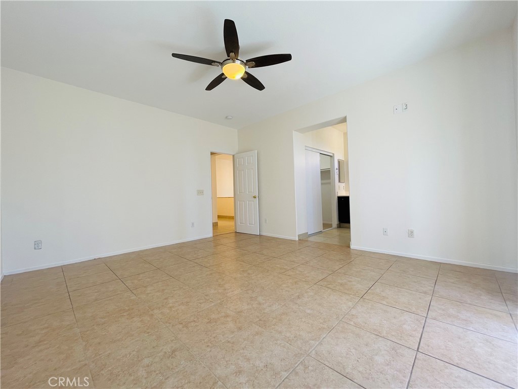 83107 Greenbrier Drive Indio, CA 92203 - Photo 16 of 29 a view of a livingroom with a ceiling fan and window