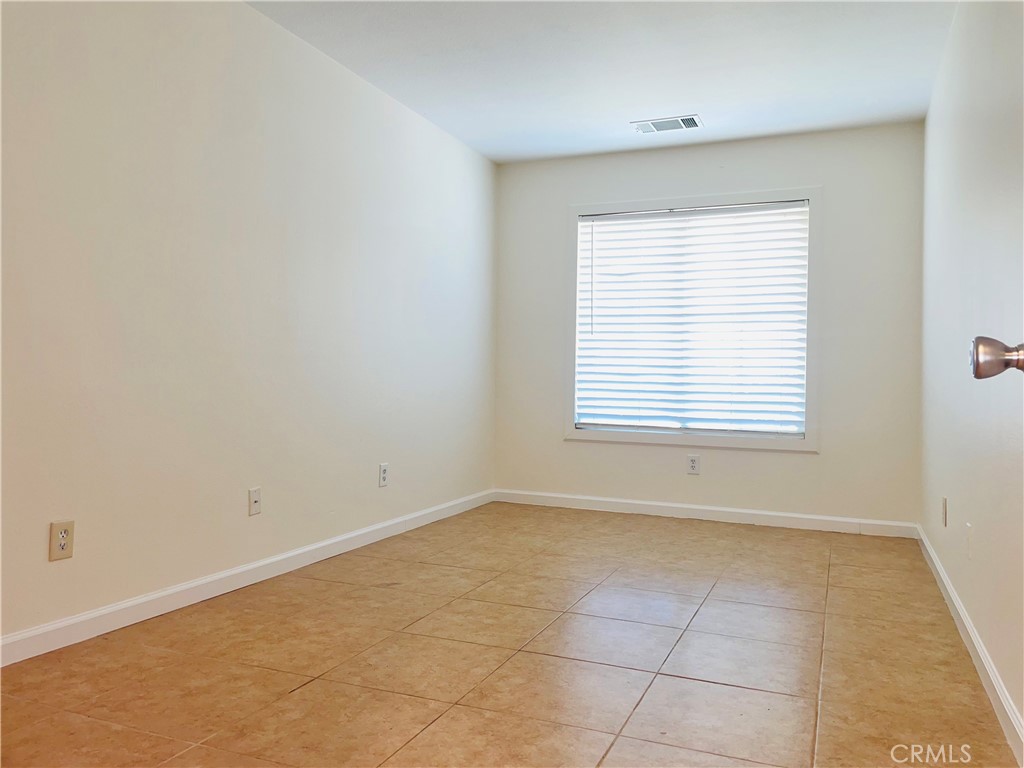 83107 Greenbrier Drive Indio, CA 92203 - Photo 20 of 29 an empty room with a window