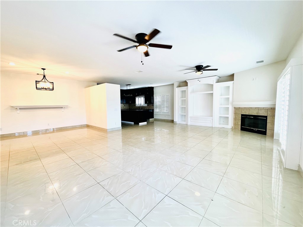 83107 Greenbrier Drive Indio, CA 92203 - Photo 9 of 29 a living room with furniture and a fireplace