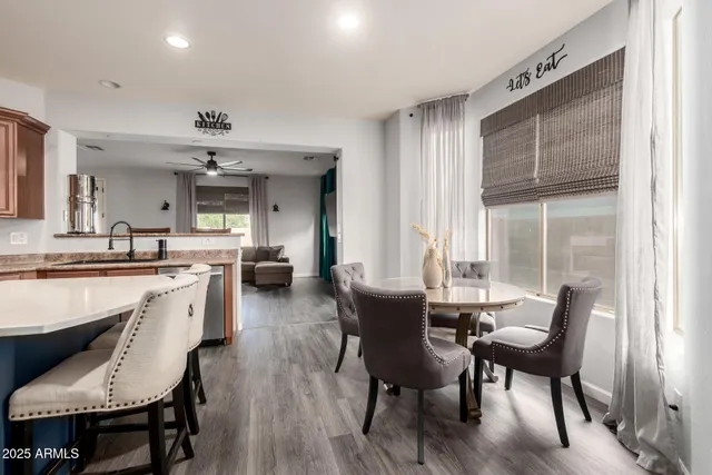 a large kitchen with a table and chairs