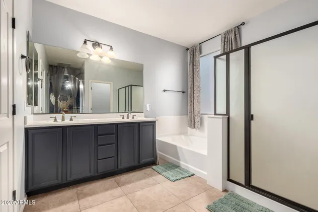 a bathroom with a bathtub a sink and a mirror