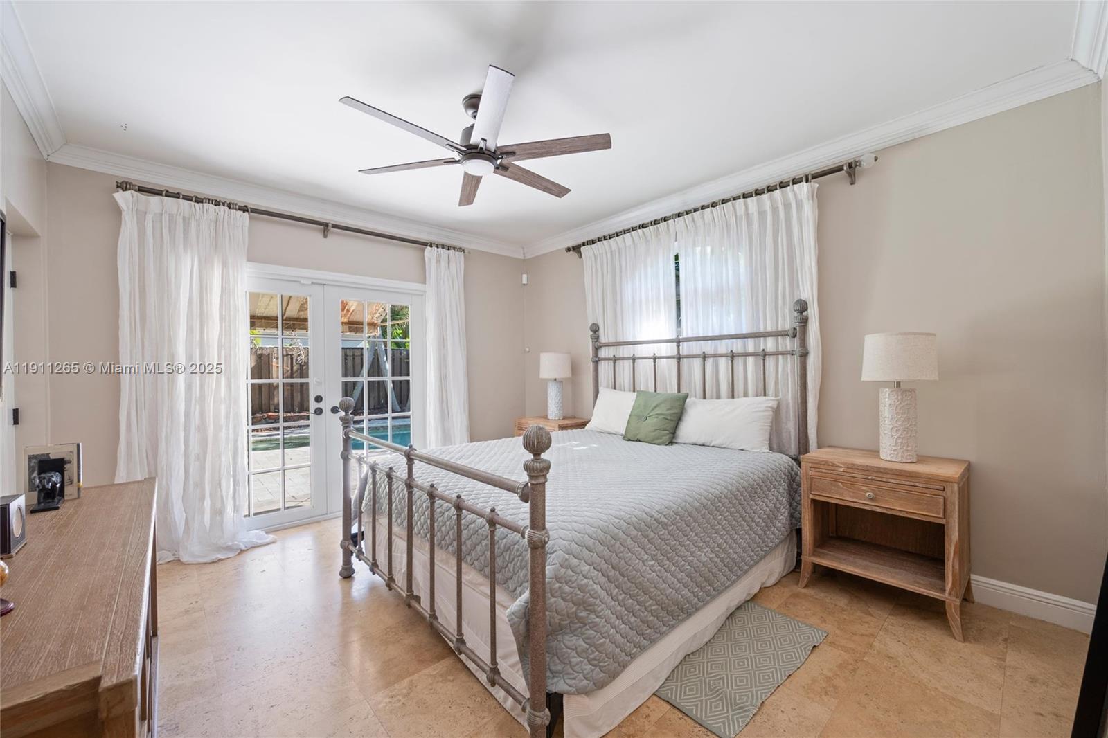 3308 Northeast 16th Place Fort Lauderdale, FL 33305 - Photo 15 of 31 a bedroom with a bed and a window