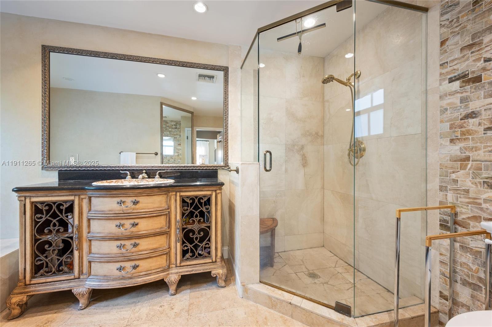 3308 Northeast 16th Place Fort Lauderdale, FL 33305 - Photo 18 of 31 a bathroom with a granite countertop sink mirror and shower