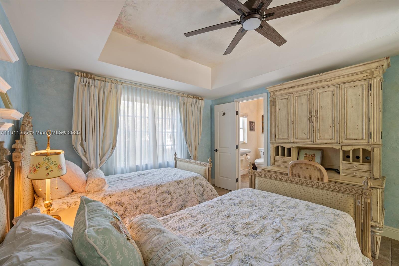 3308 Northeast 16th Place Fort Lauderdale, FL 33305 - Photo 21 of 31 a bedroom with a bed and ceiling fan