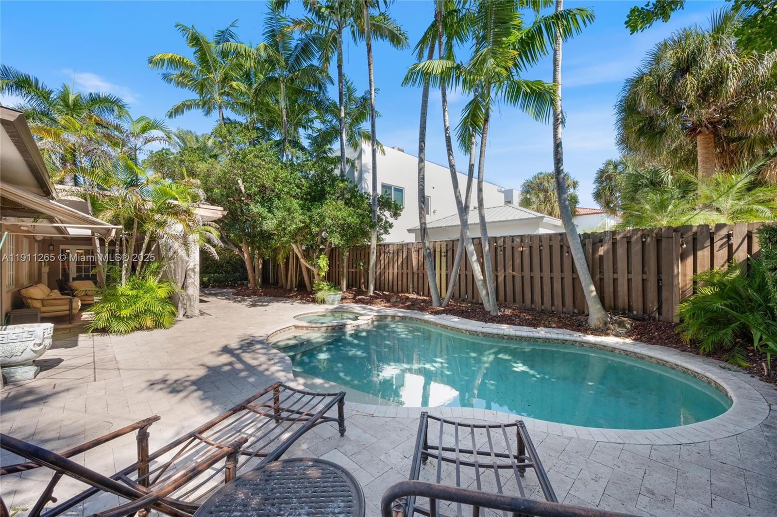 3308 Northeast 16th Place Fort Lauderdale, FL 33305 - Photo 28 of 31 a view of a backyard with a patio and a garden