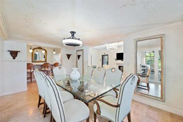 a view of a dining room with furniture wooden floor and chandelier