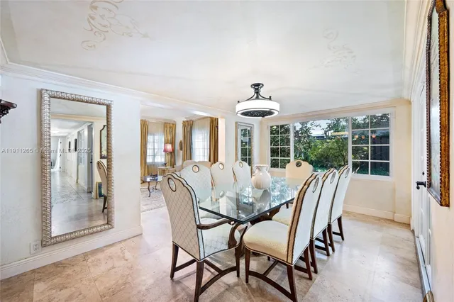 a bathroom with a granite countertop toilet a sink and a mirror